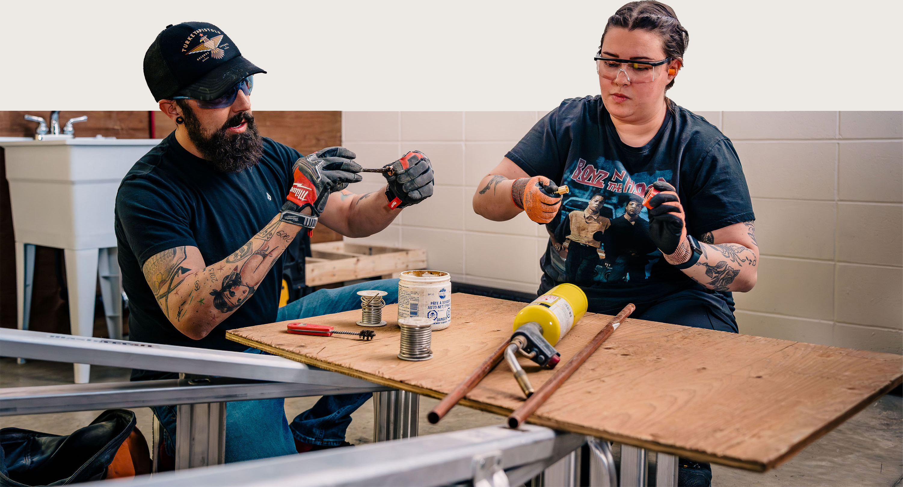 two people at a work table